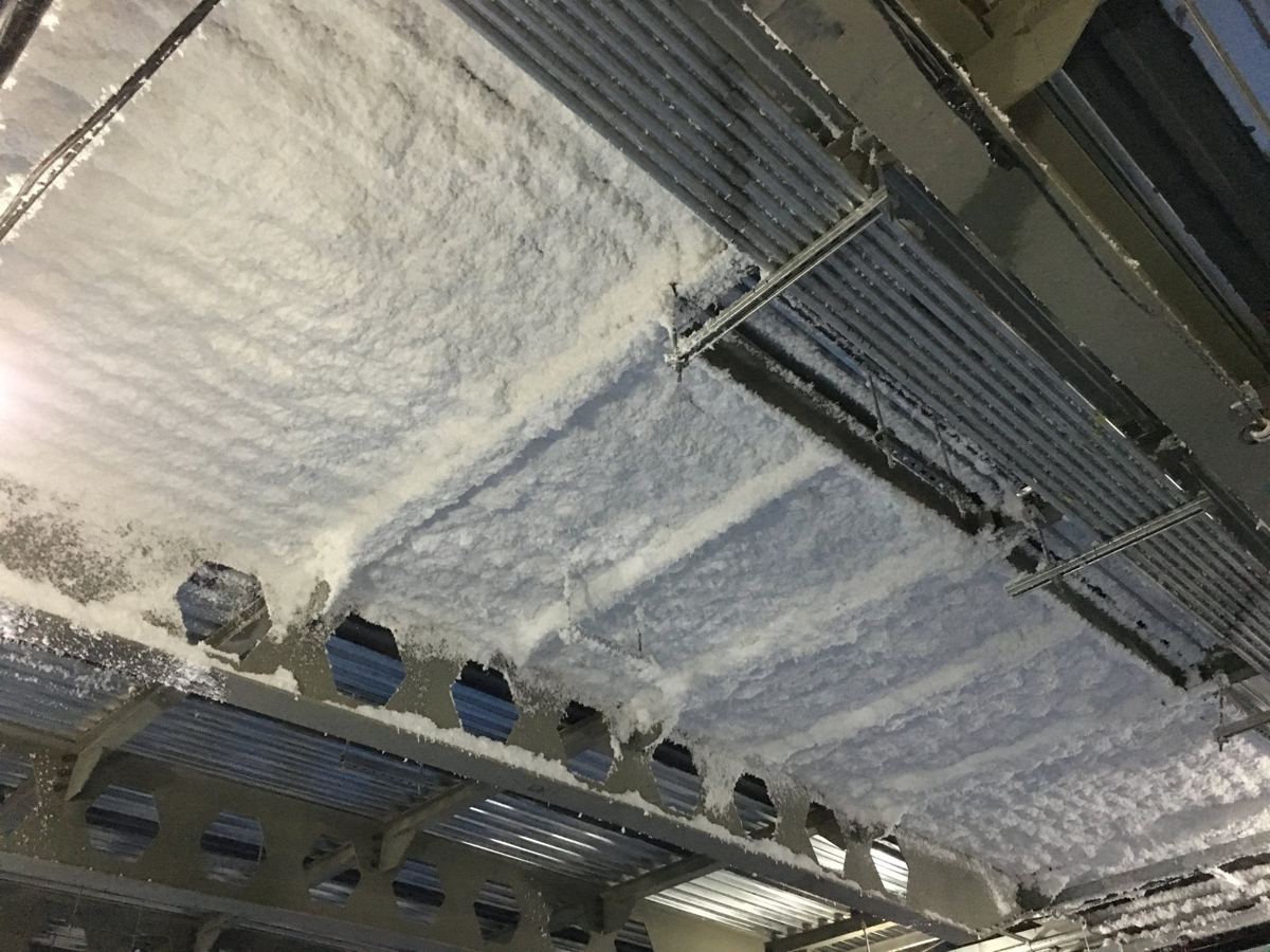 Spray foam insulation applied to a ceiling deck