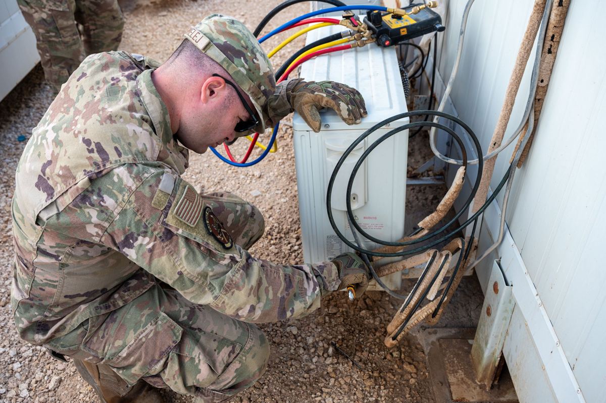 Technician connecting line set at a mini split